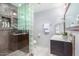 Clean bathroom with glass block shower and modern vanity at 8325 E Crestwood Way, Scottsdale, AZ 85250