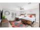 Spacious bedroom with two beds, a large rug, and access to a patio at 8325 E Crestwood Way, Scottsdale, AZ 85250