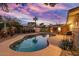 Inviting kidney shaped pool with patio furniture and sunset view at 8325 E Crestwood Way, Scottsdale, AZ 85250