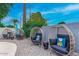 Relaxing poolside seating with wicker chairs and side tables at 8325 E Crestwood Way, Scottsdale, AZ 85250