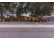 Mid-century modern home with wood fence, gravel landscaping and walkway at 8325 E Crestwood Way, Scottsdale, AZ 85250