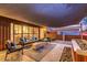 Relaxing backyard patio with fire pit and seating at dusk at 8325 E Crestwood Way, Scottsdale, AZ 85250