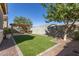 Artificial turf backyard with pergola and sitting area at 19034 W Yucatan Dr, Surprise, AZ 85388