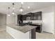 Modern kitchen with stainless steel appliances and granite countertops at 19034 W Yucatan Dr, Surprise, AZ 85388