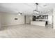 Open concept kitchen with dark cabinets, granite countertops, and island at 19034 W Yucatan Dr, Surprise, AZ 85388
