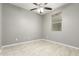 Simple bedroom with tile flooring and ceiling fan at 19034 W Yucatan Dr, Surprise, AZ 85388