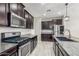 Modern kitchen with stainless steel appliances and granite countertops at 19034 W Yucatan Dr, Surprise, AZ 85388
