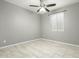 Bright bedroom with tile flooring and ceiling fan at 19034 W Yucatan Dr, Surprise, AZ 85388