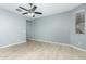 Simple bedroom with tile flooring and ceiling fan at 19034 W Yucatan Dr, Surprise, AZ 85388