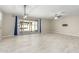 Open concept living area with tile floors and access to the backyard at 19034 W Yucatan Dr, Surprise, AZ 85388
