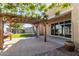 Backyard with pergola, patio, and sliding glass doors at 19034 W Yucatan Dr, Surprise, AZ 85388