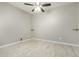 Spacious bedroom with tile flooring and a ceiling fan at 19034 W Yucatan Dr, Surprise, AZ 85388