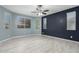Spacious bedroom with tile flooring and dual-tone walls at 19034 W Yucatan Dr, Surprise, AZ 85388
