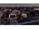 One-story home, landscaped yard, neighborhood view at dusk at 42715 N Courage Trl, Anthem, AZ 85086