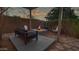 Cozy backyard patio with fire pit and seating area at 42715 N Courage Trl, Anthem, AZ 85086