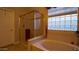 Bathroom features a walk-in shower and a soaking tub with a window at 42715 N Courage Trl, Anthem, AZ 85086
