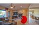 Bright and airy living room with fireplace, large windows, and comfortable seating at 42715 N Courage Trl, Anthem, AZ 85086