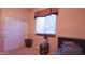 Bedroom with double closet doors and a window with blinds at 42715 N Courage Trl, Anthem, AZ 85086