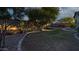 Landscaped backyard with hot tub and stone pathway at 42715 N Courage Trl, Anthem, AZ 85086