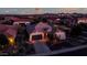 One-story home, landscaped yard, neighborhood view at dusk at 42715 N Courage Trl, Anthem, AZ 85086