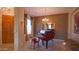 Elegant living room with grand piano and entryway at 42715 N Courage Trl, Anthem, AZ 85086