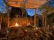 Relaxing backyard patio with fire pit and seating area at 42715 N Courage Trl, Anthem, AZ 85086