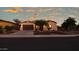 Single-story house with a landscaped front yard at dusk at 42715 N Courage Trl, Anthem, AZ 85086