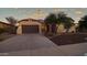 Single story home with desert landscaping at 42715 N Courage Trl, Anthem, AZ 85086