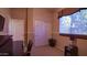 Well-lit bedroom with double doors to closet and window at 42715 N Courage Trl, Anthem, AZ 85086