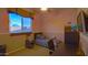 Bedroom with twin bed, desk, and window with blinds at 42715 N Courage Trl, Anthem, AZ 85086