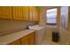 Laundry room with washer, dryer, and ample cabinets at 42715 N Courage Trl, Anthem, AZ 85086