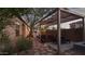 Backyard with pizza oven, pergola, and stone pathway at 42715 N Courage Trl, Anthem, AZ 85086
