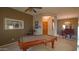 Game room with pool table and entryway view at 42715 N Courage Trl, Anthem, AZ 85086