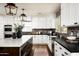 Spacious kitchen with white cabinets, brick backsplash, and large island at 88 N Country Club Dr, Phoenix, AZ 85014