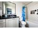 Modern bathroom with subway tile, black countertop, and blue camouflage shower curtain at 88 N Country Club Dr, Phoenix, AZ 85014