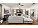 Living room with comfortable sectional sofa, fireplace, and large TV at 88 N Country Club Dr, Phoenix, AZ 85014