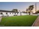 Large backyard with artificial turf and plenty of space for recreation at 88 N Country Club Dr, Phoenix, AZ 85014