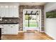 Kitchen with French doors opening to a backyard patio and lawn at 88 N Country Club Dr, Phoenix, AZ 85014