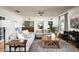 Open living space with sectional sofa, coffee table, and views to kitchen at 88 N Country Club Dr, Phoenix, AZ 85014