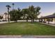 Spacious backyard with a large lawn and mature trees at 88 N Country Club Dr, Phoenix, AZ 85014