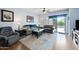 Living room with gray couch and sliding glass doors at 1095 W Desert Valley Dr, San Tan Valley, AZ 85143