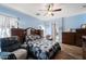 Bright bedroom with a comfortable bed and ensuite bathroom access at 1095 W Desert Valley Dr, San Tan Valley, AZ 85143