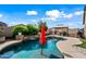 Inviting backyard oasis featuring a sparkling pool, gazebo, and lush landscaping at 1095 W Desert Valley Dr, San Tan Valley, AZ 85143