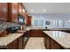 Kitchen features granite countertops and dark wood cabinets at 1095 W Desert Valley Dr, San Tan Valley, AZ 85143