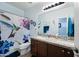 Double vanity bathroom with a hummingbird shower curtain at 1095 W Desert Valley Dr, San Tan Valley, AZ 85143