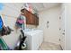 Bright laundry room with washer, dryer, and ample cabinet space at 1095 W Desert Valley Dr, San Tan Valley, AZ 85143