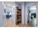 Hallway with built-in bookcase and access to bedrooms at 1095 W Desert Valley Dr, San Tan Valley, AZ 85143