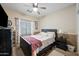 Cozy bedroom with a double bed and ceiling fan at 1095 W Desert Valley Dr, San Tan Valley, AZ 85143