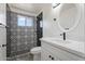 Updated bathroom with patterned tile, white vanity, and modern fixtures at 5714 N 19Th Dr, Phoenix, AZ 85015