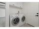 Laundry room with washer, dryer, and overhead cabinets at 5714 N 19Th Dr, Phoenix, AZ 85015